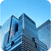 Dynamic view of modern glass skyscrapers under a clear blue sky, illustrating corporate expansion signifying an ipo filing