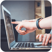 Hands collaborating on a laptop screen, reviewing financial data for GAAP reporting.