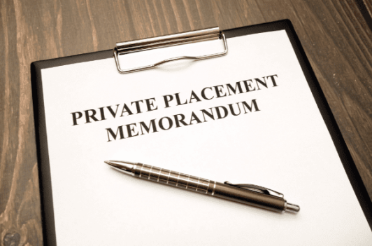 Private placement memorandum on a clipboard with a pen, relevant for securities filings using EDGAR codes.
