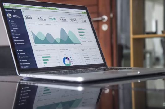 Analytics dashboard on a laptop for data-driven decisions and Form C-AR and C-TR filing support.